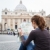 Pretty young female tourist studying a map at St. Peter's square stock photo © lightpoet