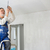 Senior man installing a bulb in a freshly renovated appartment stock photo © lightpoet