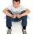Pre teen boy sitting in jeans and t-shirt stock photo © lovleah