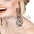 Woman with earrings and false lashes. stock photo © lubavnel
