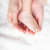 Mother gently hold baby's leg in her hands stock photo © luckyraccoon
