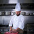 Chef cutting meat in restaurant kitchen stock photo © lunamarina