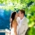 couple in love kissing in forest tree blue lake stock photo © lunamarina