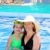 mother and daughter hug in pool tropical beach stock photo © lunamarina