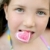 Beautiful teen portrait eating a candy heart stock photo © lunamarina
