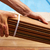 Ipe deck installation carpenter hands holding wood stock photo © lunamarina