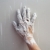 Astist plastering man hand with cracked plaster stock photo © lunamarina