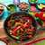 Beef fajitas in a pan sauces chili and sides Mexican stock photo © lunamarina
