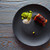 Grilled smoked eel on black plate stock photo © lunamarina