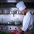 Chef cutting meat in restaurant kitchen stock photo © lunamarina