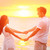 romantikus · pár · szerelmespár · kéz · a · kézben · tengerpart · naplemente - stock fotó © Maridav
