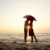 пару · целоваться · зонтик · пляж · закат · воды - Сток-фото © Massonforstock