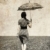 Girl with umbrella on field. Photo in old image style.  stock photo © Massonforstock