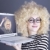 Portrait of funny girl in blonde wig with laptop stock photo © Massonforstock