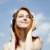 Redhead girl with headphone at sky background. stock photo © Massonforstock