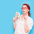 Portrait of redhead woman in red glasses with money stock photo © Massonforstock