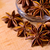 Star Anise in the Glass Bowl on Wooden Table stock photo © maxpro