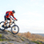Cyclist in Red Jacket Riding the Bike Down Rocky Hill. Extreme Sport. stock photo © maxpro