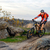 Cyclist in Red Jacket Riding the Bike on Rocky Trail. Extreme Sport. stock photo © maxpro