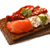 Bread crisp with salmon, soft cheese, dried tomatoes and chervil stock photo © maxsol7