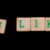 Letters on wooden blocks (unlike) stock photo © michaklootwijk