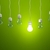 Row of light bulbs on green background stock photo © MikhailMishchenko