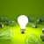 Light bulb on green background stock photo © MikhailMishchenko