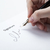 pen in the man's hand and signature stock photo © mizar_21984