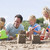 familie · plajă · nisip · castele · zâmbitor - imagine de stoc © monkey_business