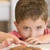 Young boy in kitchen eating cookies stock photo © monkey_business