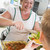 Lunchlady serving plate of lunch in school cafeteria stock photo © monkey_business