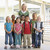 Kindergarten teacher standing with children in corridor stock photo © monkey_business