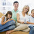 Family sitting in living room with remote control smiling stock photo © monkey_business