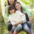 Mother and daughters outdoors in woods sitting on log smiling stock photo © monkey_business