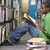 egyetemi · hallgató · dolgozik · könyvtár · férfi · ül · padló - stock fotó © monkey_business