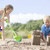 Brother and sister at beach making sand castles stock photo © monkey_business