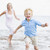 Mother and son running on beach smiling stock photo © monkey_business