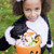 Young girl outdoors in cat costume on Halloween holding candy stock photo © monkey_business