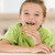 Young boy eating cookie in living room smiling stock photo © monkey_business