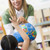 kleuterschool · leraar · kinderen · naar · wereldbol · vrouw - stockfoto © monkey_business