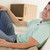 Man in living room listening to headphones smiling stock photo © monkey_business