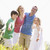 Family standing outdoors holding hands smiling stock photo © monkey_business