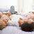 Man lying in bed with two young girls smiling stock photo © monkey_business