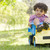 Young boy outdoors playing on toy dump truck smiling stock photo © monkey_business