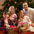 Family Opening Christmas Present In Front Of Tree stock photo © monkey_business