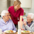 Senior women with carer enjoying meal at home stock photo © monkey_business