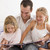 Man in bedroom with two young girls reading book and smiling stock photo © monkey_business