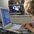 Young boy in bedroom using laptop and listening to MP3 player stock photo © monkey_business