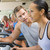 Personal Trainer Encouraging Woman Using Treadmill At Gym stock photo © monkey_business