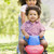 Sister pushing brother on toy with wheels smiling stock photo © monkey_business